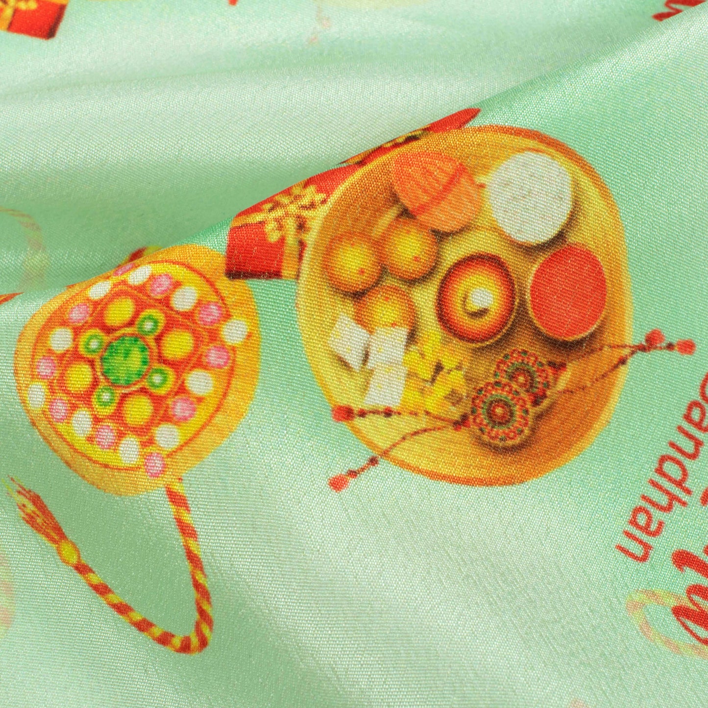 Mint Green And Amber Orange Rakhi Pattern Digital Print Crepe Silk Fabric