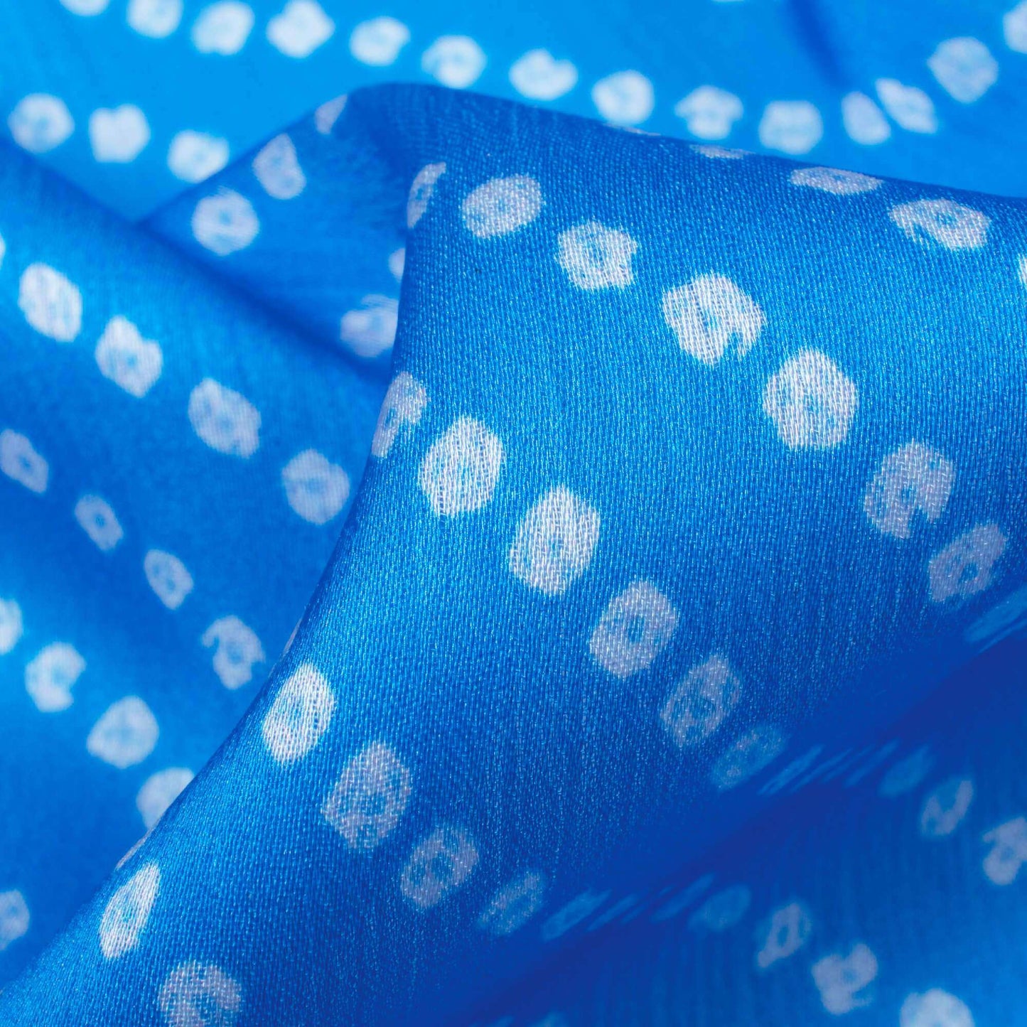 Azure Blue And White Bandhani Pattern Digital Print Chiffon Satin Fabric - Fabcurate