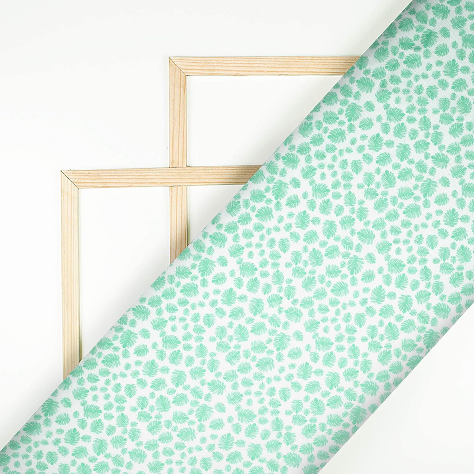 Krutika's Choice White And Sea Green Leaf Pattern Digital Print Chiffon Satin Fabric - Fabcurate