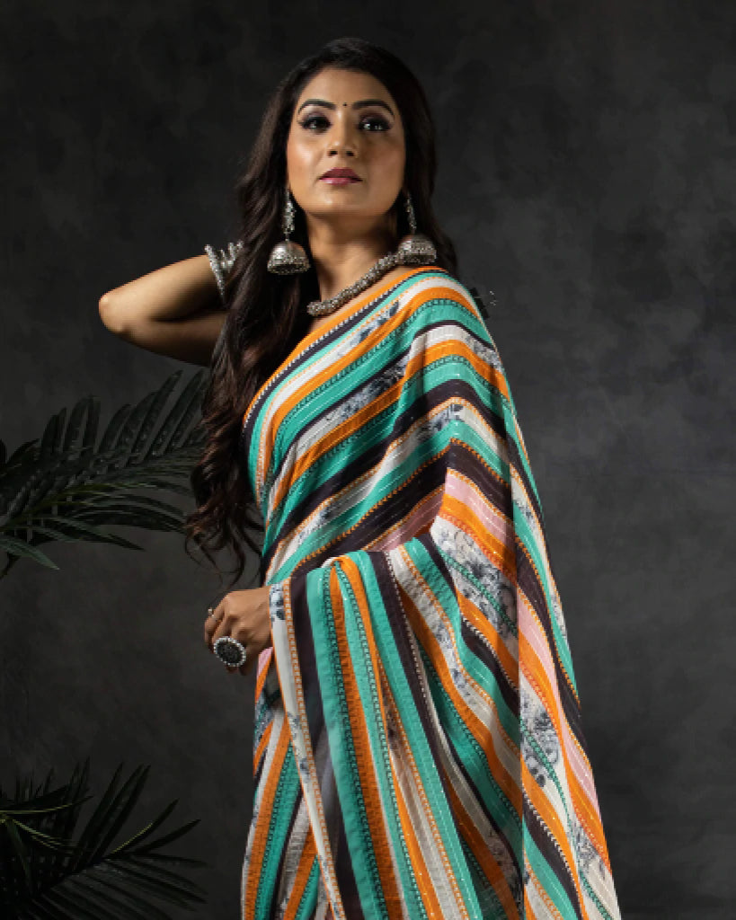 Ocean Green And Carrot Orange Stripes Pattern Premium Sequins Georgette Saree With Tassels