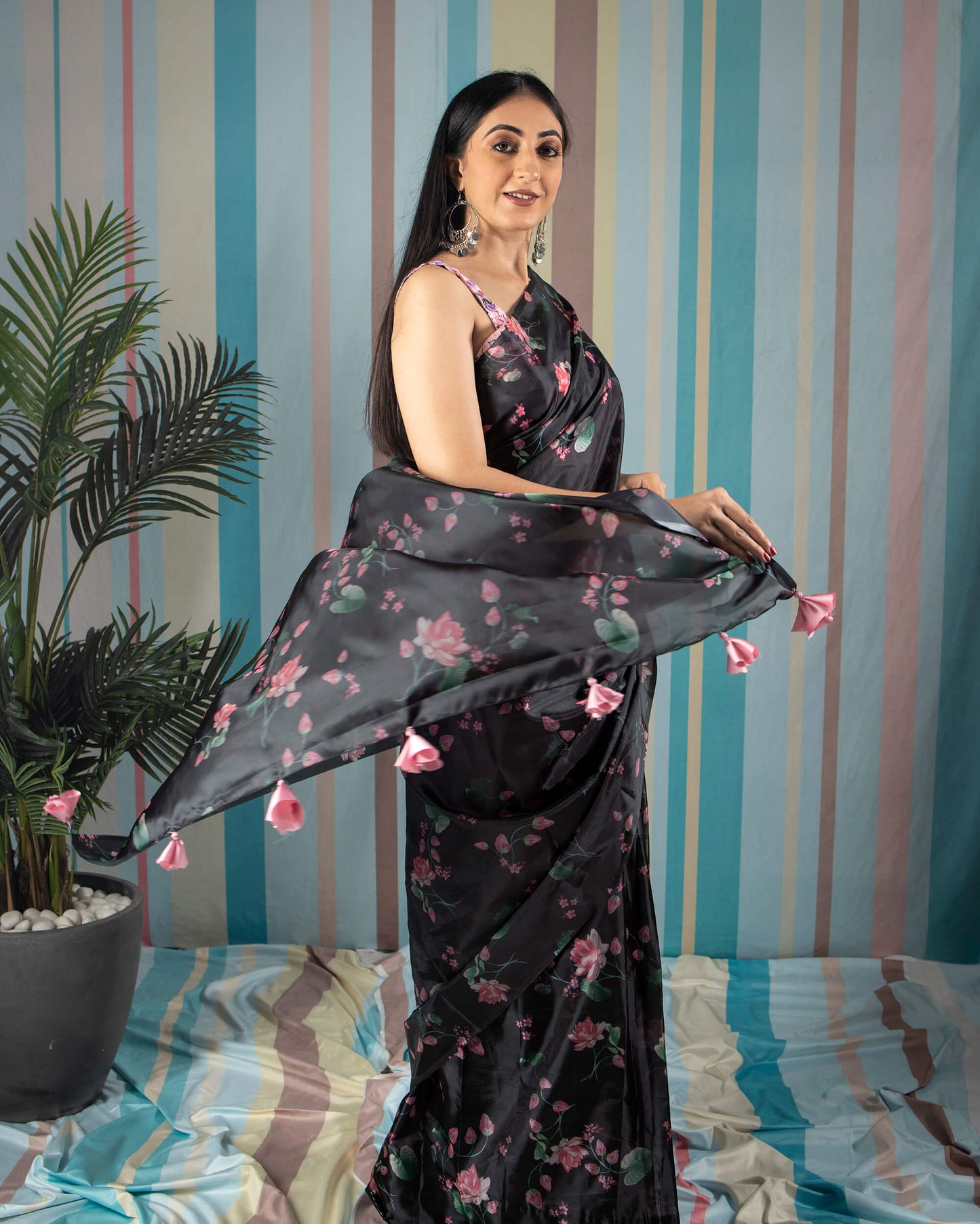 Black And Pink Floral Pattern Liquid Organza Saree With Tassels