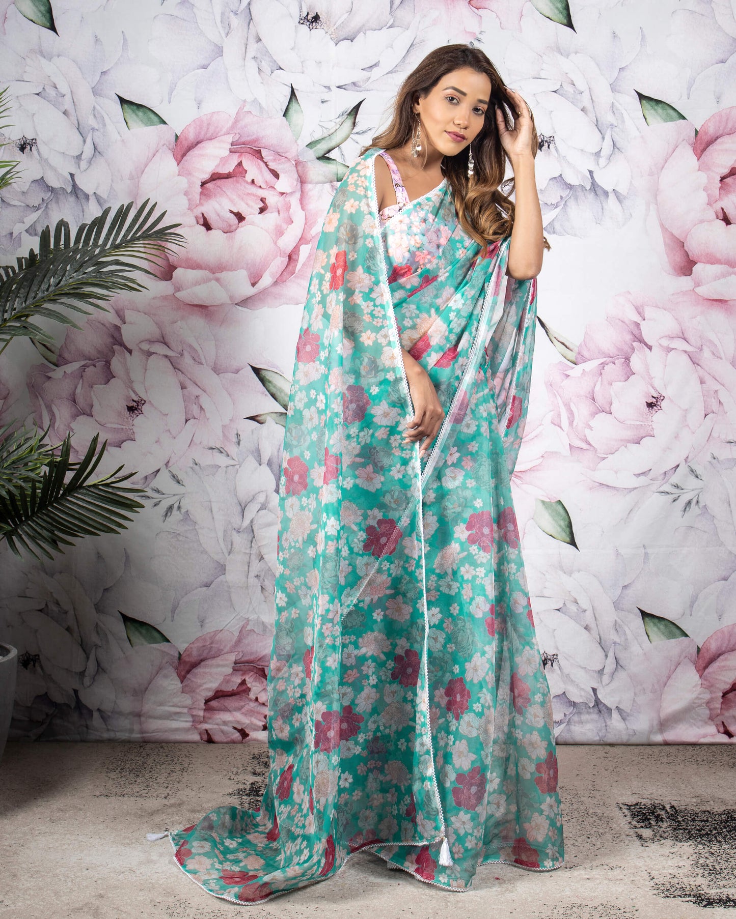 Tuquoise And Pink Floral Pattern Organza Saree With Pearl Work Lace Border