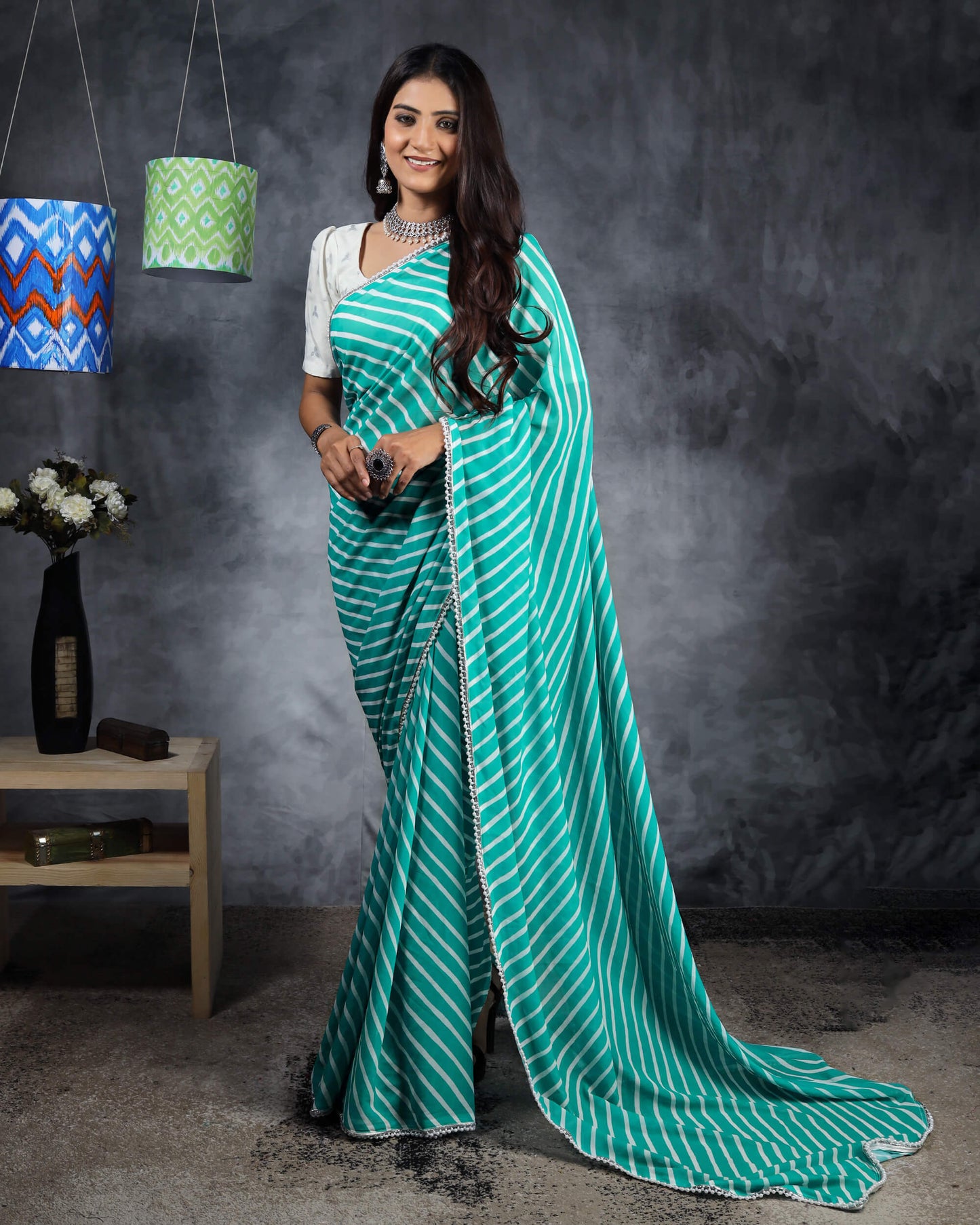 Turquoise Leheriya Printed Pearl Delight Georgette Saree