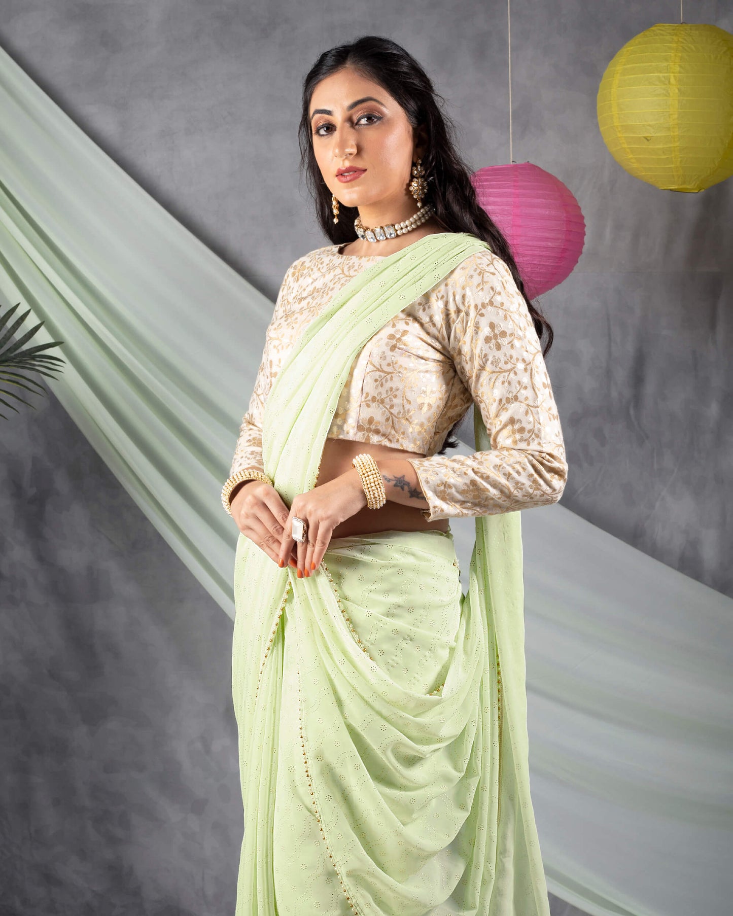 Tea Green Leheriya Golden Dew Drops Georgette Saree With Pearl Work Lace Border