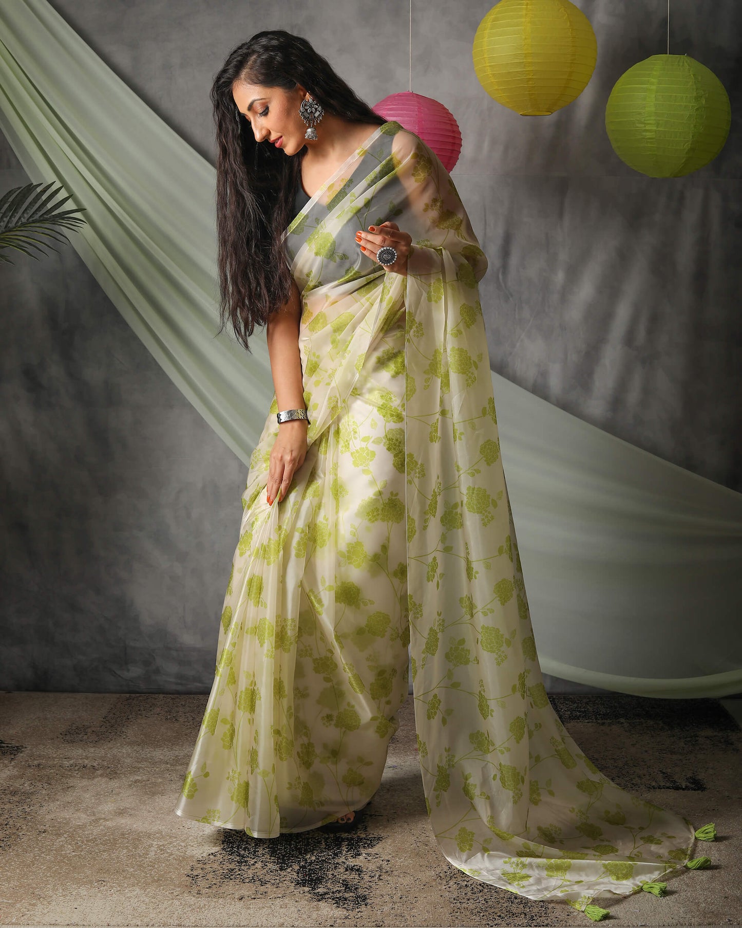 Moss Green And Off White Floral Pattern Organza Saree With Tassels