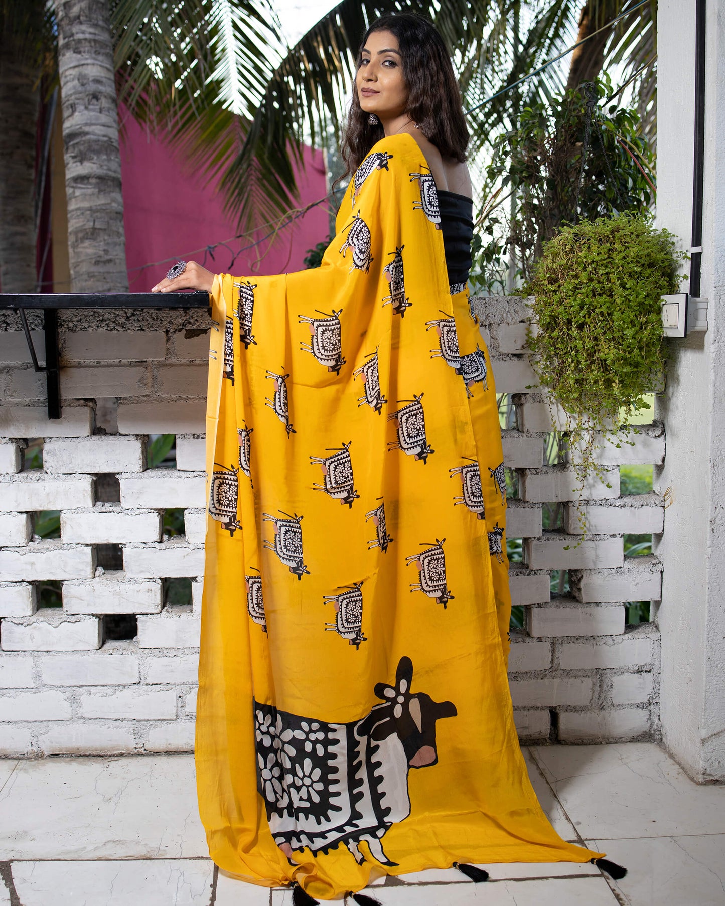 Gold Yellow And Black Animal Pattern Digital Print Natural Crepe Saree With Tassels