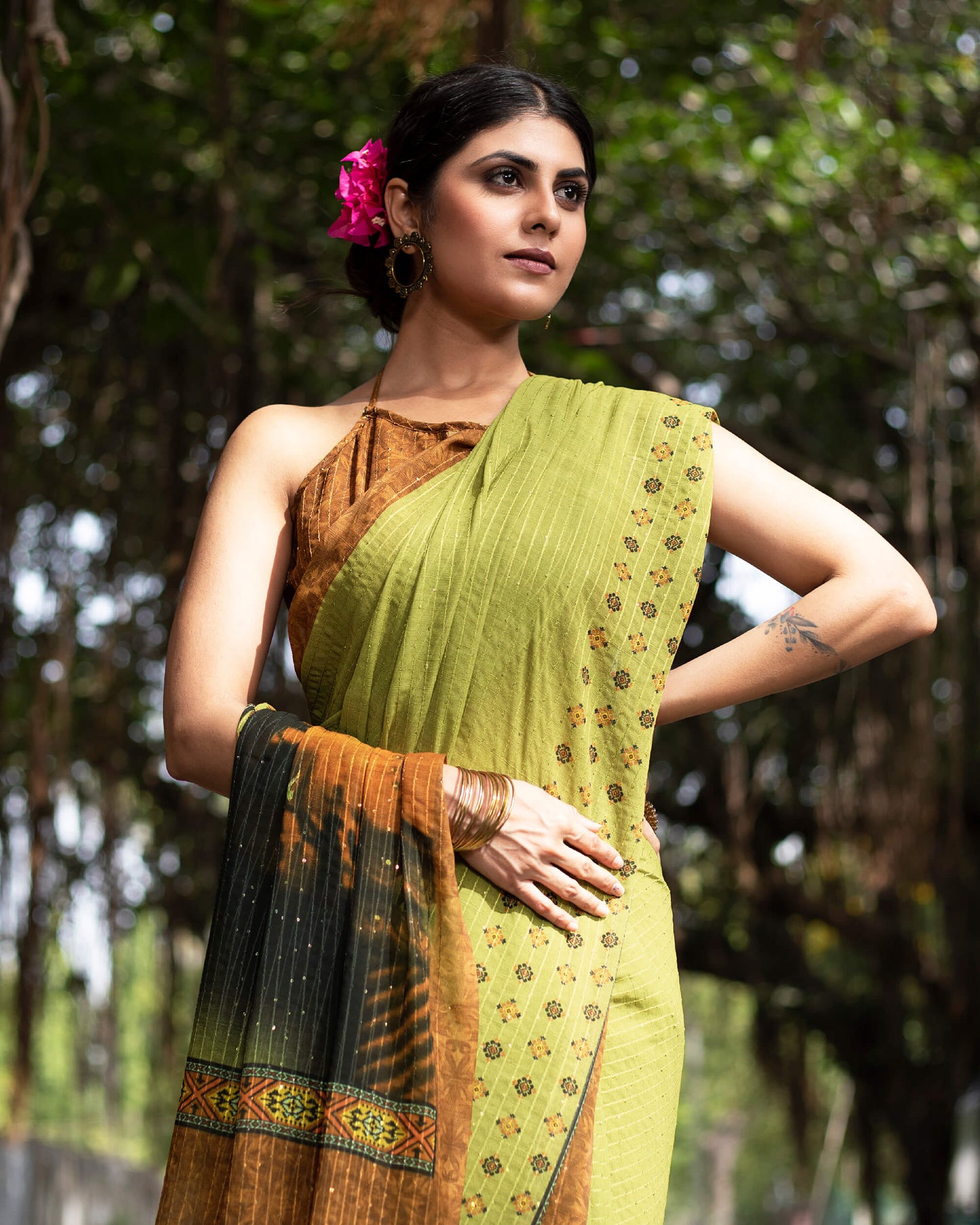 Olive Green And Black Quirky Pattern Premium Sequins Georgette Saree With Tassels