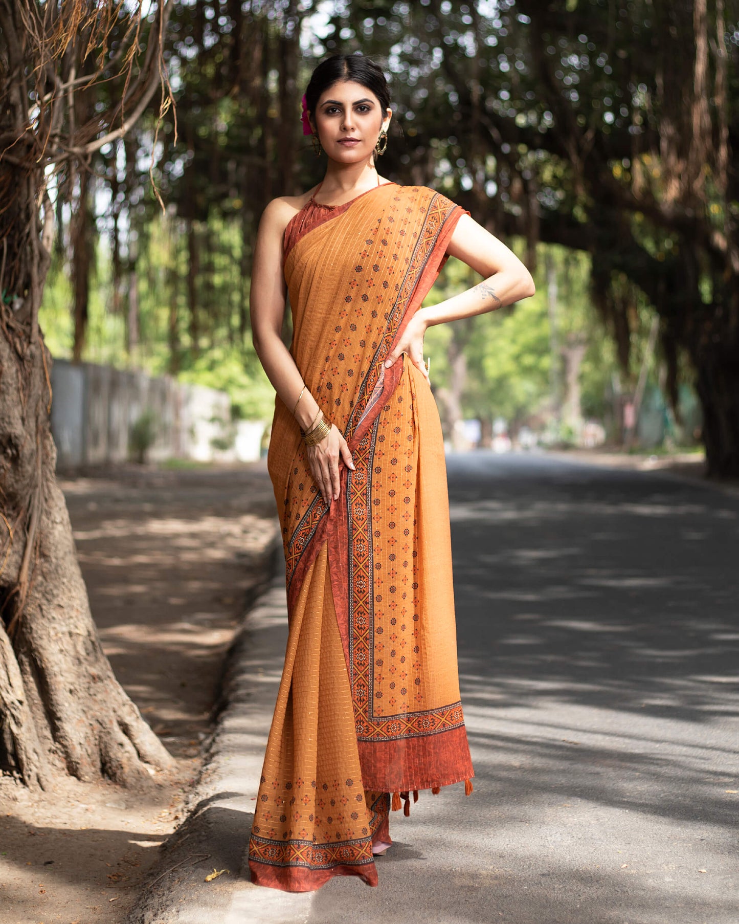 Cidar Orange And Black Quirky Pattern Premium Sequins Georgette Saree With Tassels