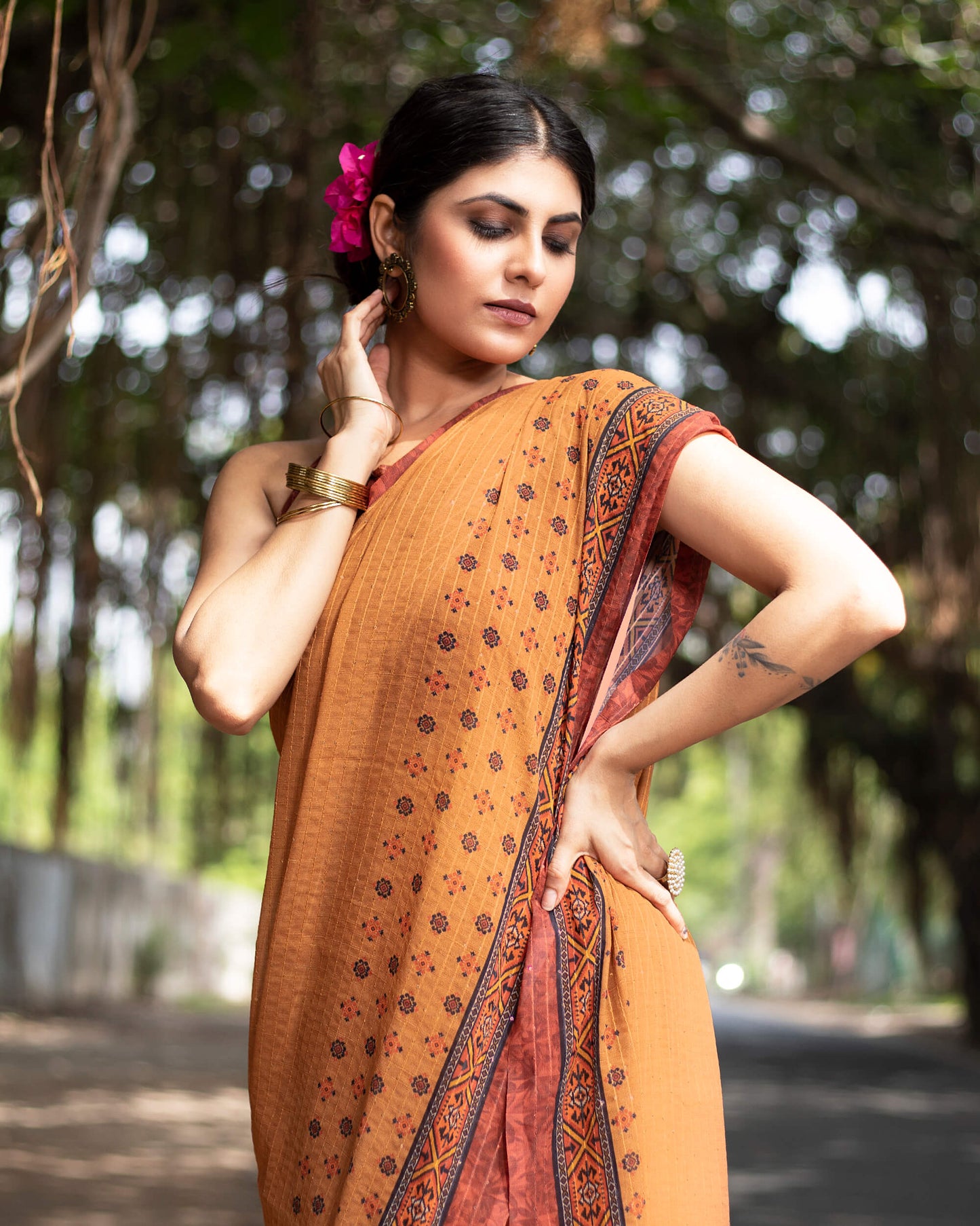 Cidar Orange And Black Quirky Pattern Premium Sequins Georgette Saree With Tassels
