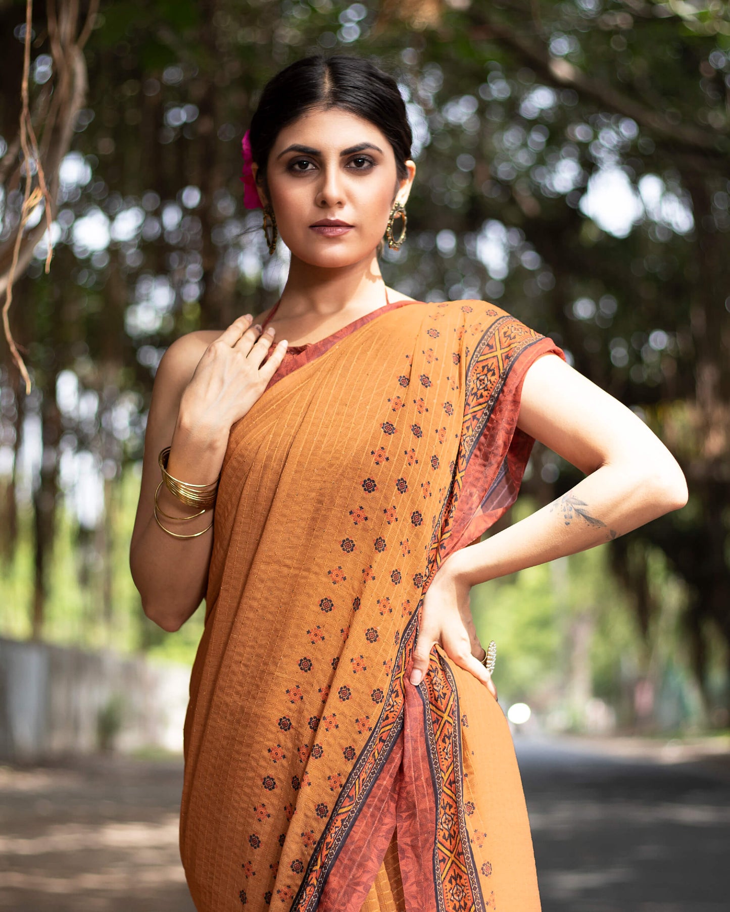 Cidar Orange And Black Quirky Pattern Premium Sequins Georgette Saree With Tassels