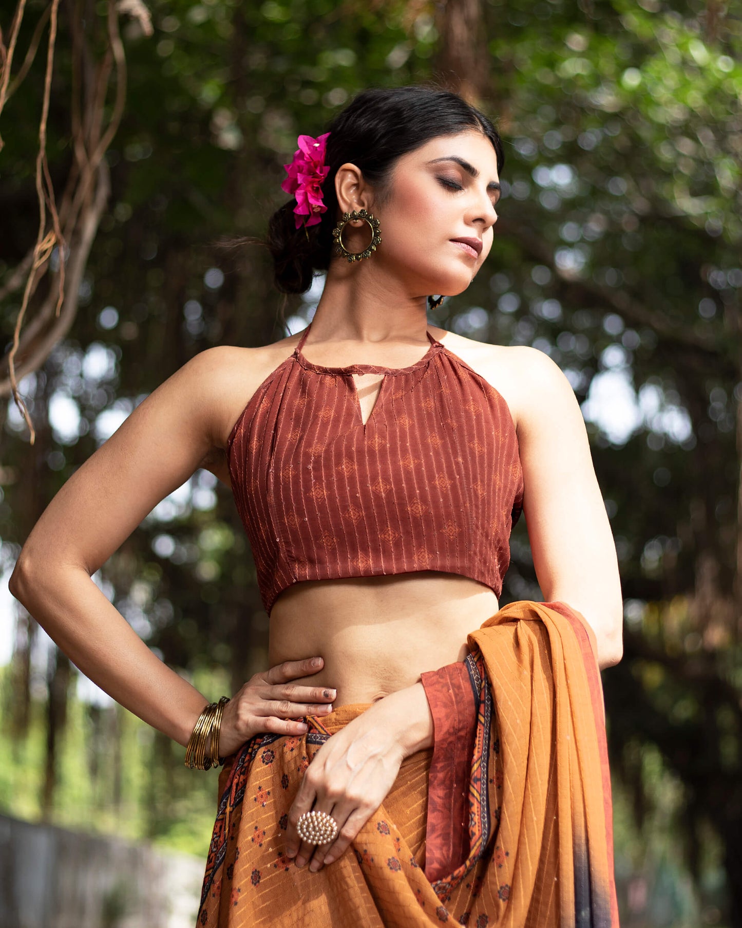 Cidar Orange And Black Quirky Pattern Premium Sequins Georgette Saree With Tassels