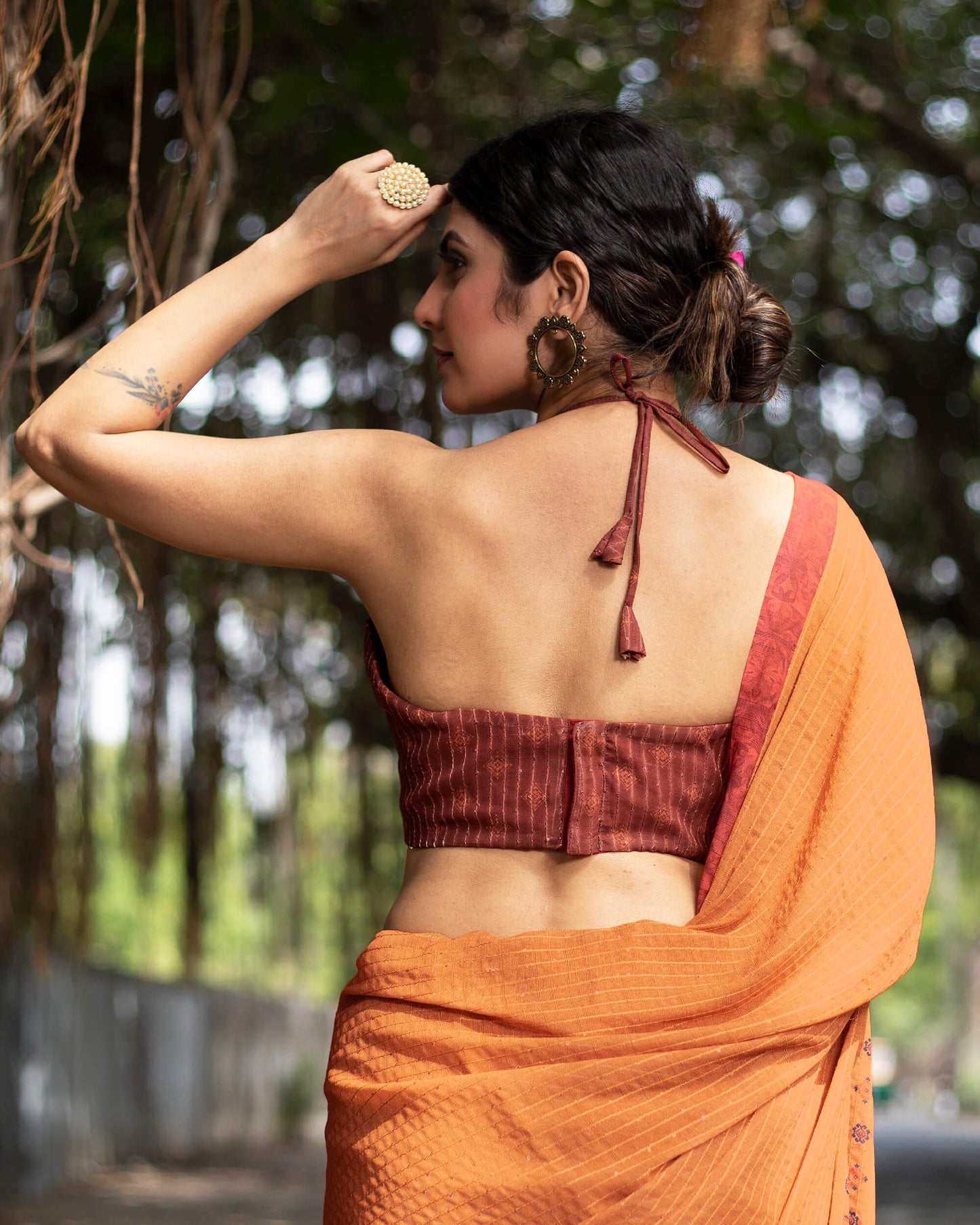 Cidar Orange And Black Quirky Pattern Premium Sequins Georgette Saree With Tassels