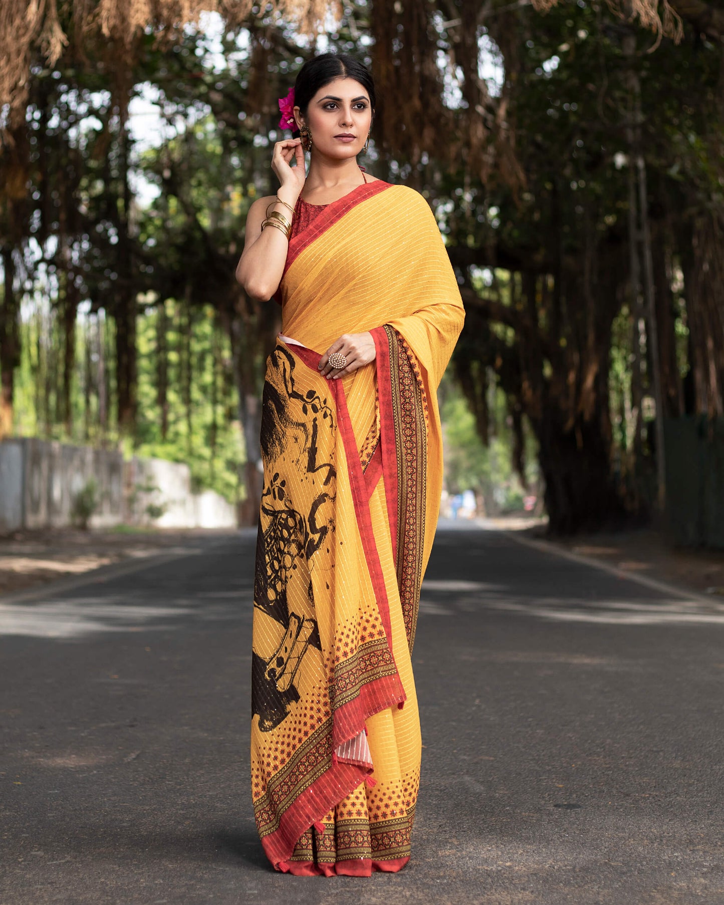 Merigold Yellow And Black Quirky Pattern Premium Sequins Georgette Saree With Tassels