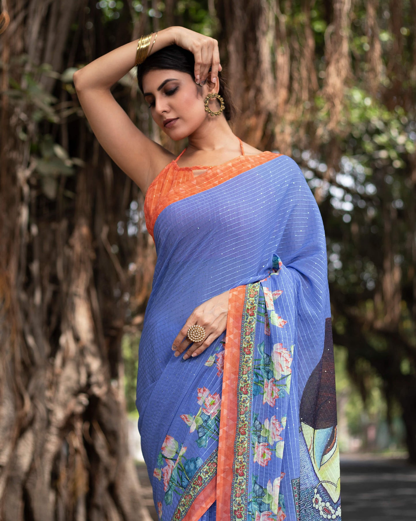 Cornflower Blue and Salmon Orange Quirky Pattern Premium Sequins Georgette Saree With Tassels