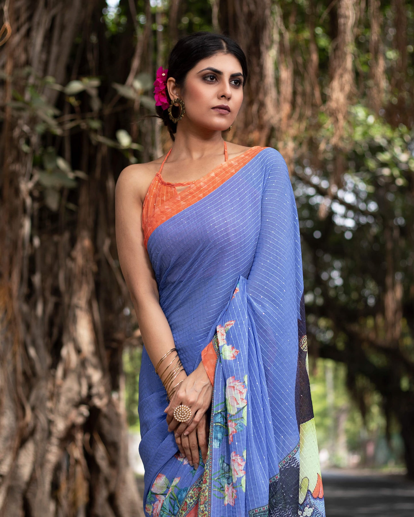 Cornflower Blue and Salmon Orange Quirky Pattern Premium Sequins Georgette Saree With Tassels