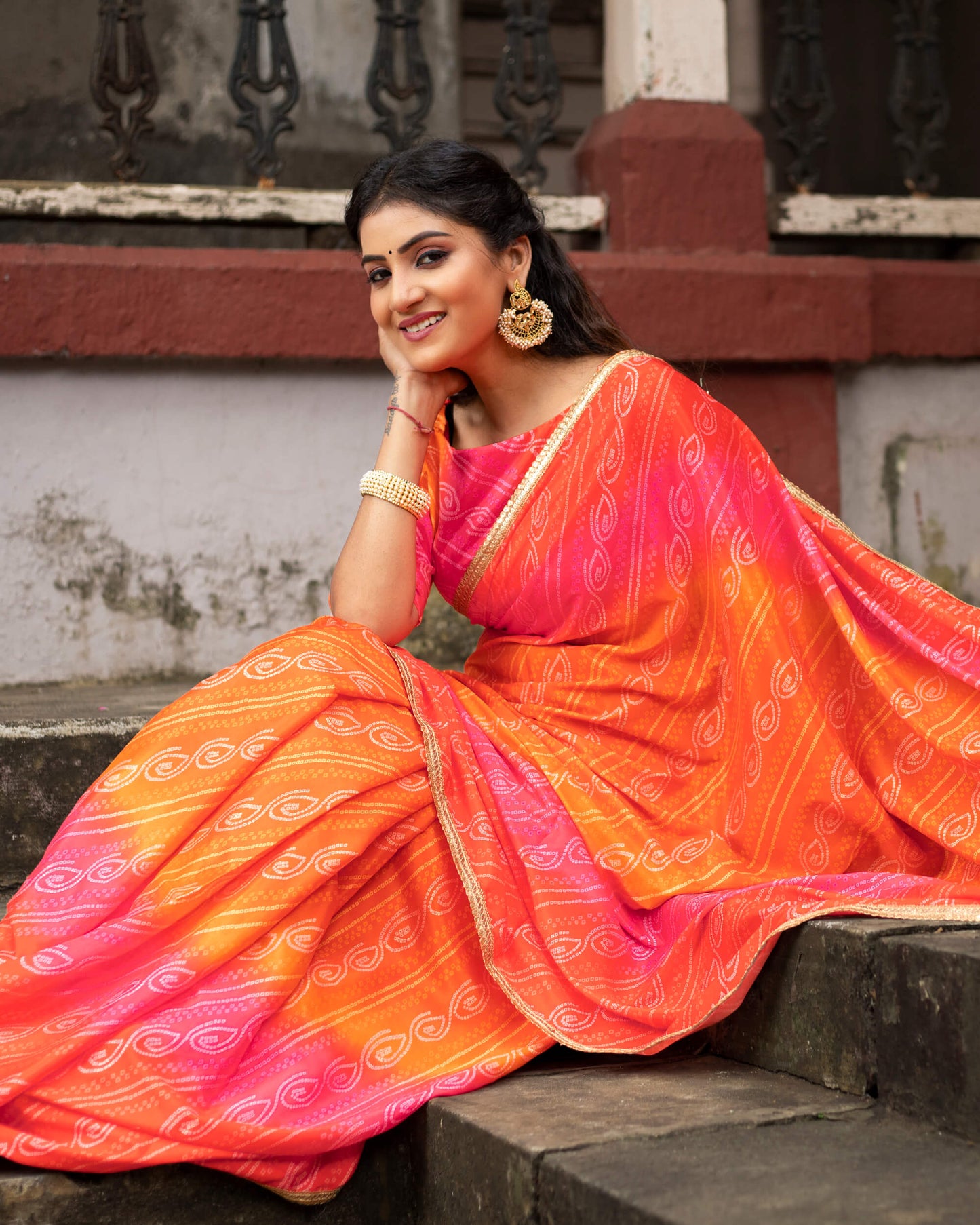 Candy Red And Carrot Orange Bandhanii Pattern Digital Print Crepe Silk Saree With Sequins Lace