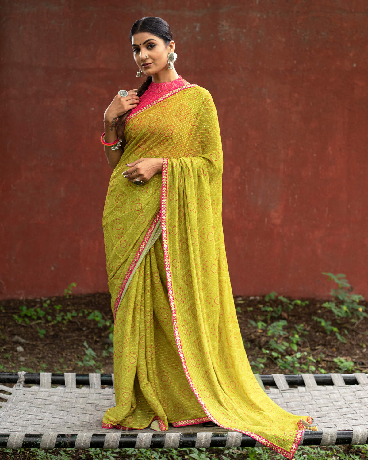 Olive Green And Pink Bandhanii Pattern Sequins Georgette Saree With Lace Border