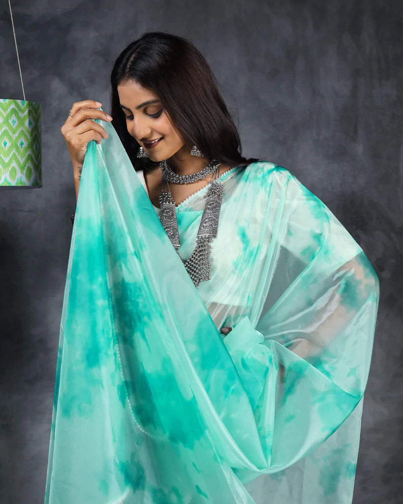 Pale Blue Tye And Dye Pattern Liquid Organza Saree With Pearl Work Lace Border