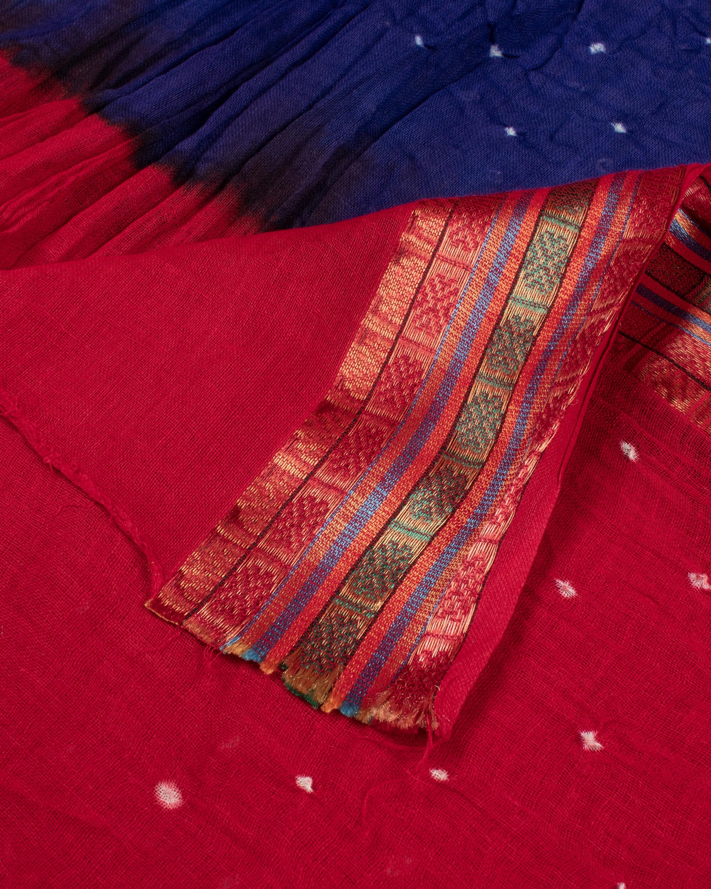 Vermillion Red And Blue Kutchi Bandhani Foil Mirror Work Unstitched Cotton Suit With Zari Border Stripes Dupatta