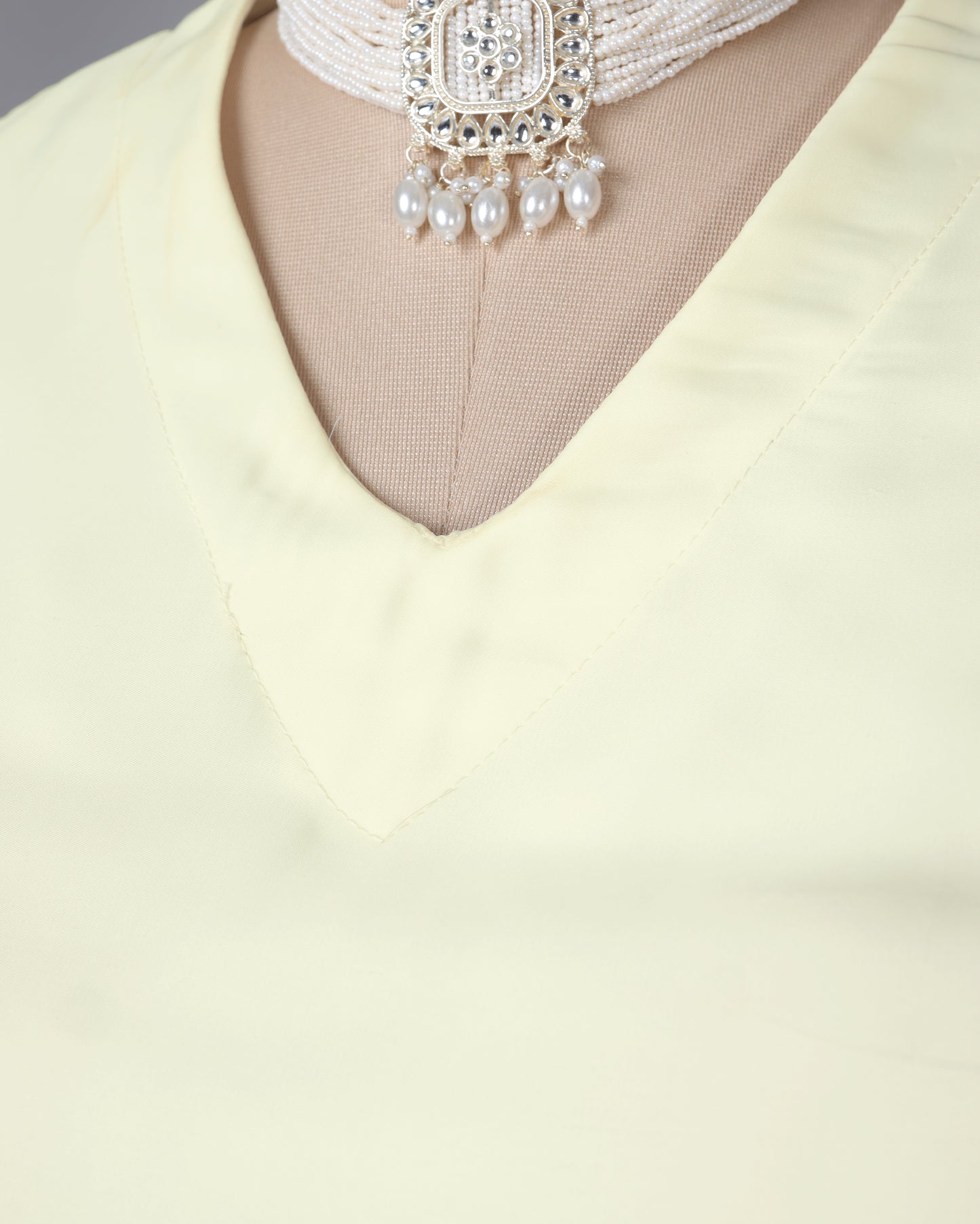Off White Plain Sleeveless V-Neck Blouse