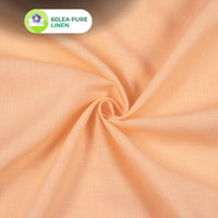 Close-up of beige fabric with '60LEA PURE LINEN' label in the corner.