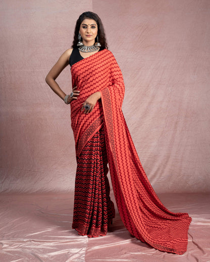 Blush Red And Black Chevron Pattern Bagh Print Handblock Natural Dye Rayon Saree With Tassels