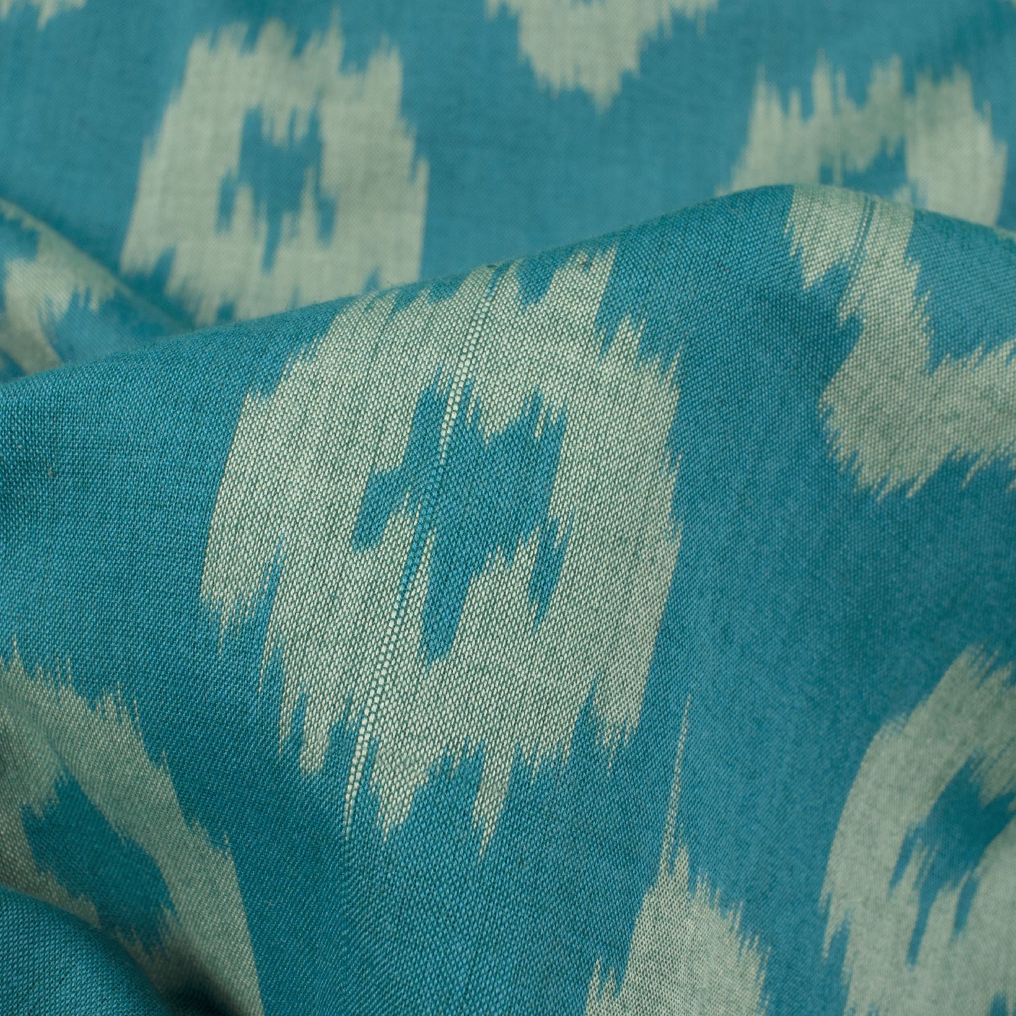 Teal Blue And Snow White Geometric Pattern Pre-Washed Mercerised Ikat Cotton Fabric - Fabcurate