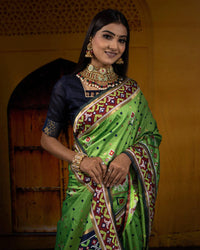Parakeet Green And Navy Blue Patolaa Pattern Zari Jacquard Bordered Premium Banarasi Silk Saree With Blouse