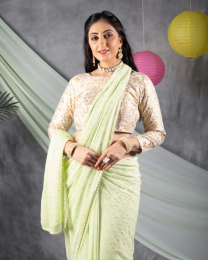 Tea Green Leheriya Golden Dew Drops Georgette Saree With Pearl Work Lace Border