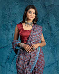 Maroon And Maya Blue Paisley Pattern Bagh Print Sequins Embroidery Handblock Natural Dye Cotton Saree With Tassels