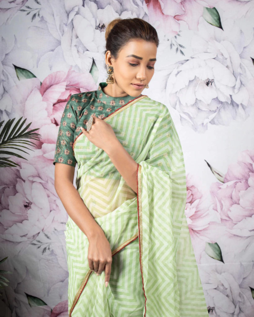 Sage Green And White Chevron Pattern Organza Saree With Sequins Lace Border