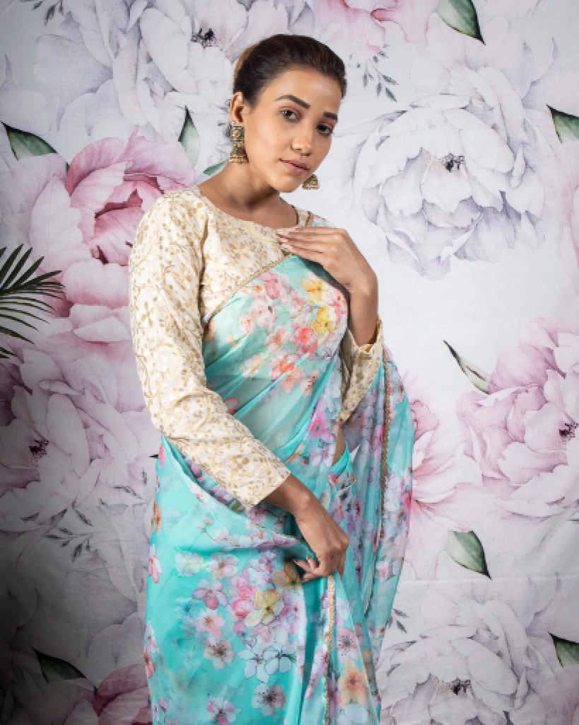 Celeste Blue And Pink Floral Pattern Organza Saree With Zari Lace Border