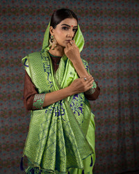 Parakeet Green And Navy Blue Floral Pattern Zari Jacquard Bordered Premium Banarasi Silk Saree With Blouse