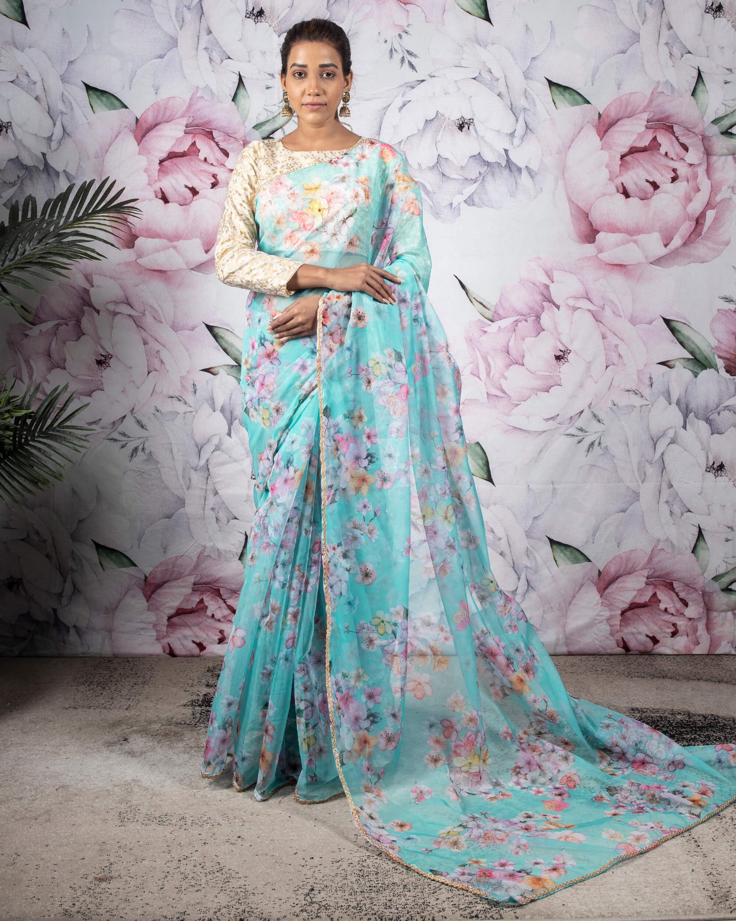 Celeste Blue And Pink Floral Pattern Organza Saree With Zari Lace Border
