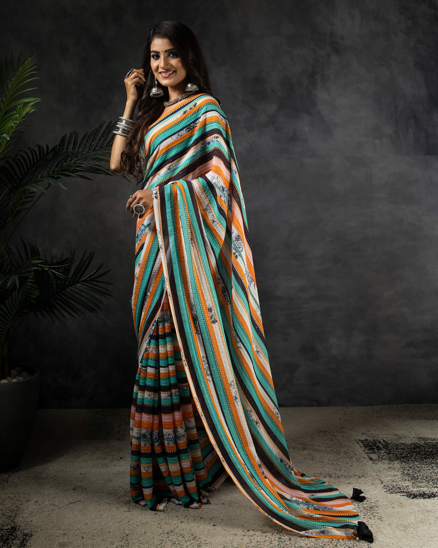 Ocean Green And Carrot Orange Stripes Pattern Premium Sequins Georgette Saree With Tassels