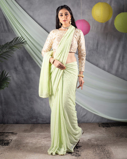 Tea Green Leheriya Golden Dew Drops Georgette Saree With Pearl Work Lace Border