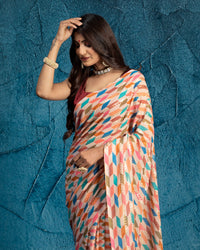 Peach And Blue Abstract Pattern Half Strieps Sequins Embroidery Digital Print Georgette Saree With Tassels