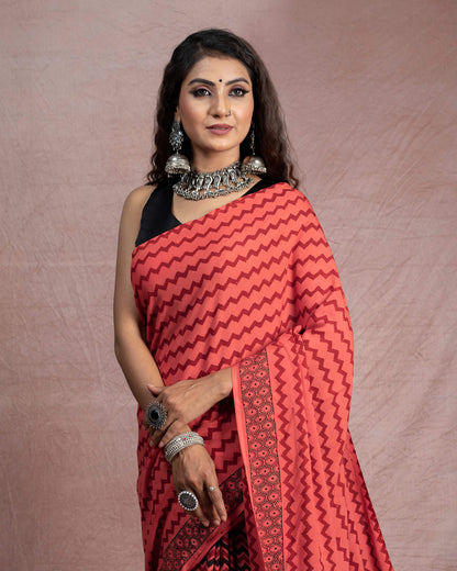 Blush Red And Black Chevron Pattern Bagh Print Handblock Natural Dye Rayon Saree With Tassels