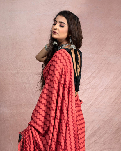 Blush Red And Black Chevron Pattern Bagh Print Handblock Natural Dye Rayon Saree With Tassels
