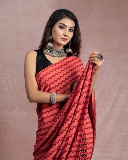 Blush Red And Black Chevron Pattern Bagh Print Handblock Natural Dye Rayon Saree With Tassels