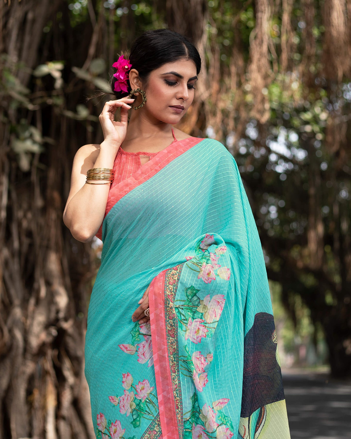 Turquoise Blue And Pink Quirky Pattern Premium Sequins Georgette Saree With Tassels