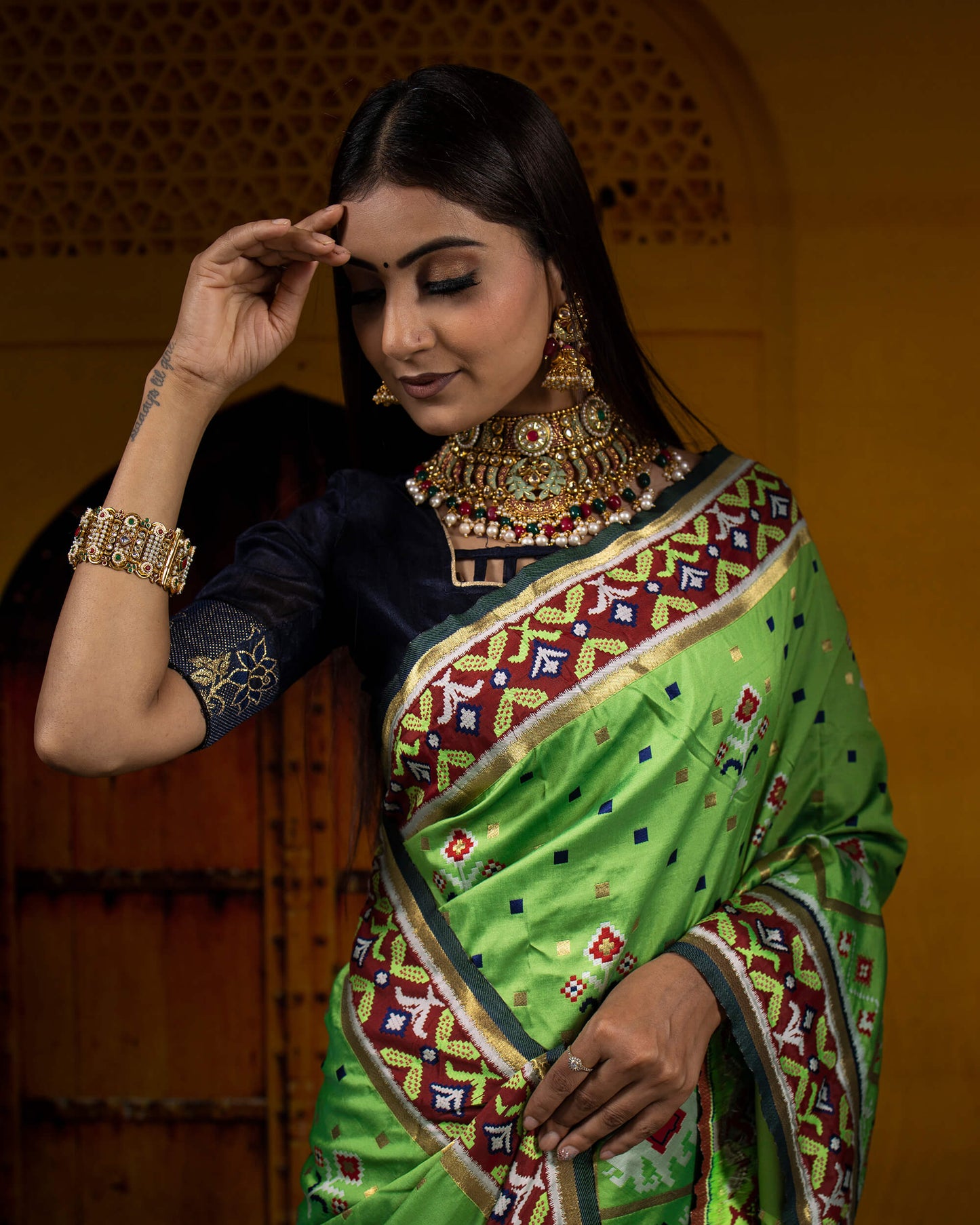 Parakeet Green And Navy Blue Patola Pattern Zari Jacquard Bordered Premium Banarasi Silk Saree With Blouse