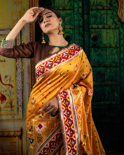 Fire Yellow And Red Patolaa Pattern Zari Jacquard Bordered Premium Banarasi Silk Saree With Blouse