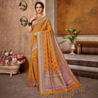 Honey Yellow And Purple Ikkat Pattern Zari Jacquard Bordered Art Tussar Silk Saree With Tassels