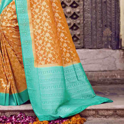 Yellow And Sea Green Floral Pattern Zari Jacquard Bordered Art Silk Saree