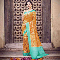 Yellow And Sea Green Floral Pattern Zari Jacquard Bordered Art Silk Saree