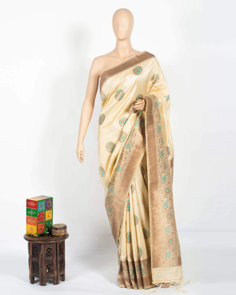 Cream And Beige Booti Pattern Zari Jacquard Borderd Art Tussar Silk Saree With Tassels