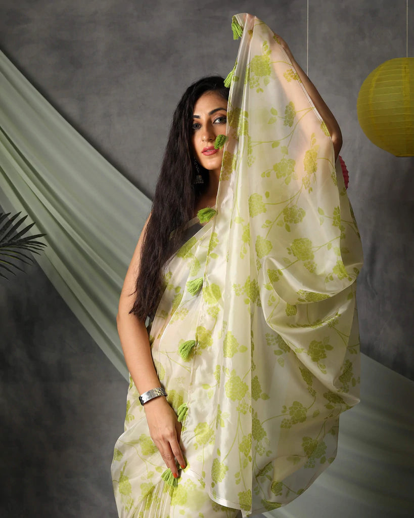 Moss Green And Off White Floral Pattern Organza Saree With Tassels