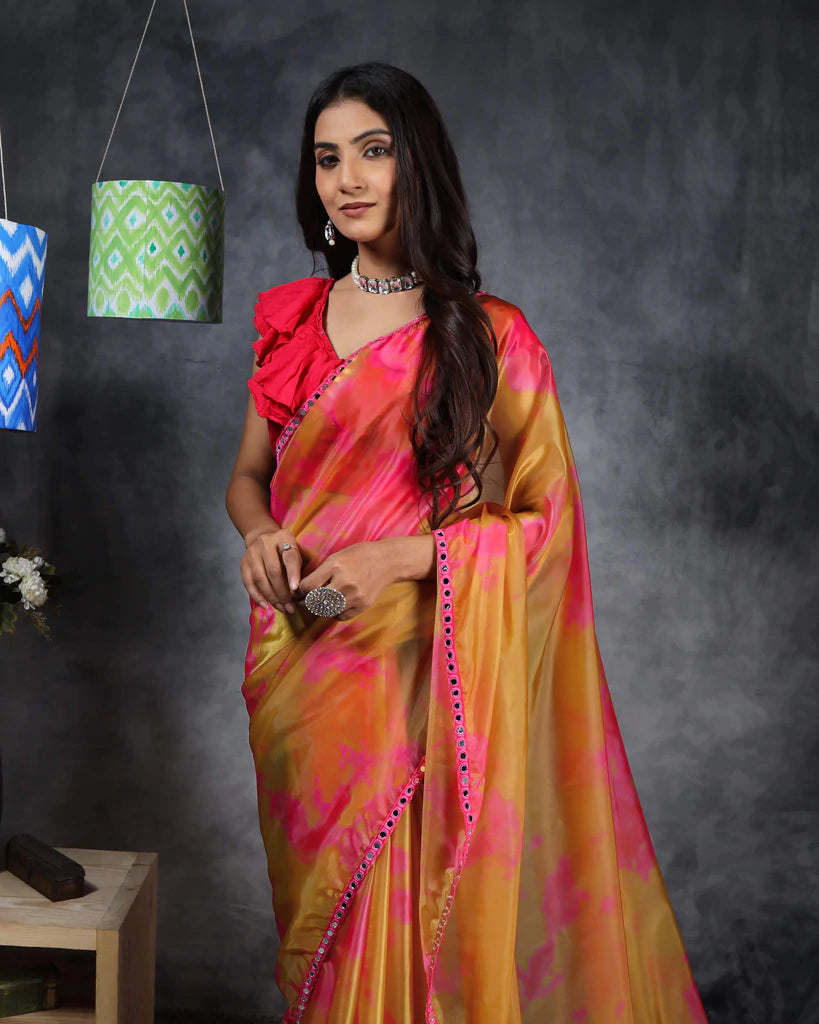 Mustard Yellow And Pink Tye And Dye Pattern Liquid Organza Saree With Mirror Work Lace Border