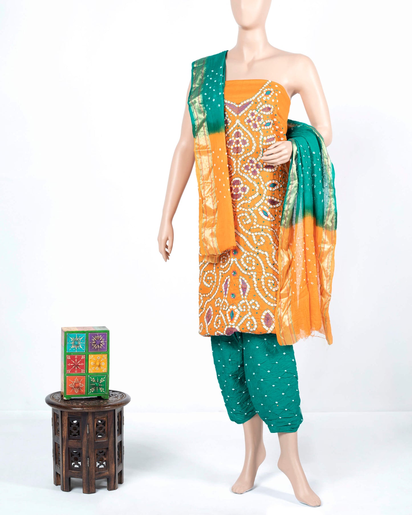 Honey Yellow And Green Kutchi Bandhani Foil Mirror Work Unstitched Cotton Suit With Zari Border Dupatta